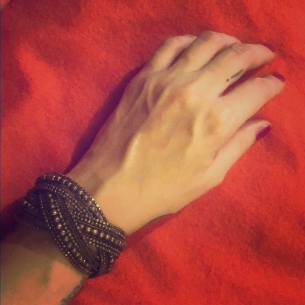 Dark gold flexible beaded bracelet.